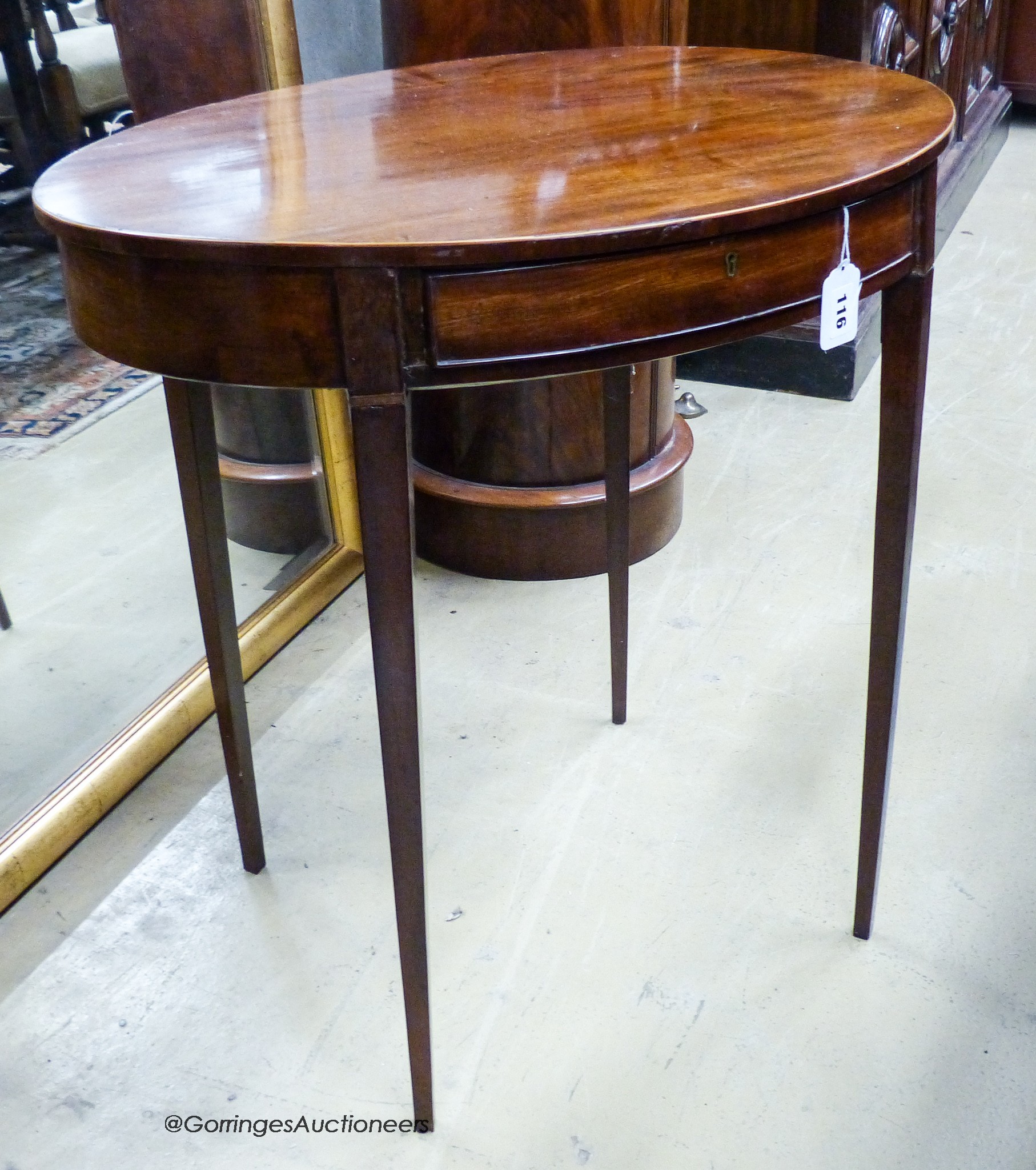 An early 19th century and later oval mahogany table, width 65cm, depth 49cm, height 67cm